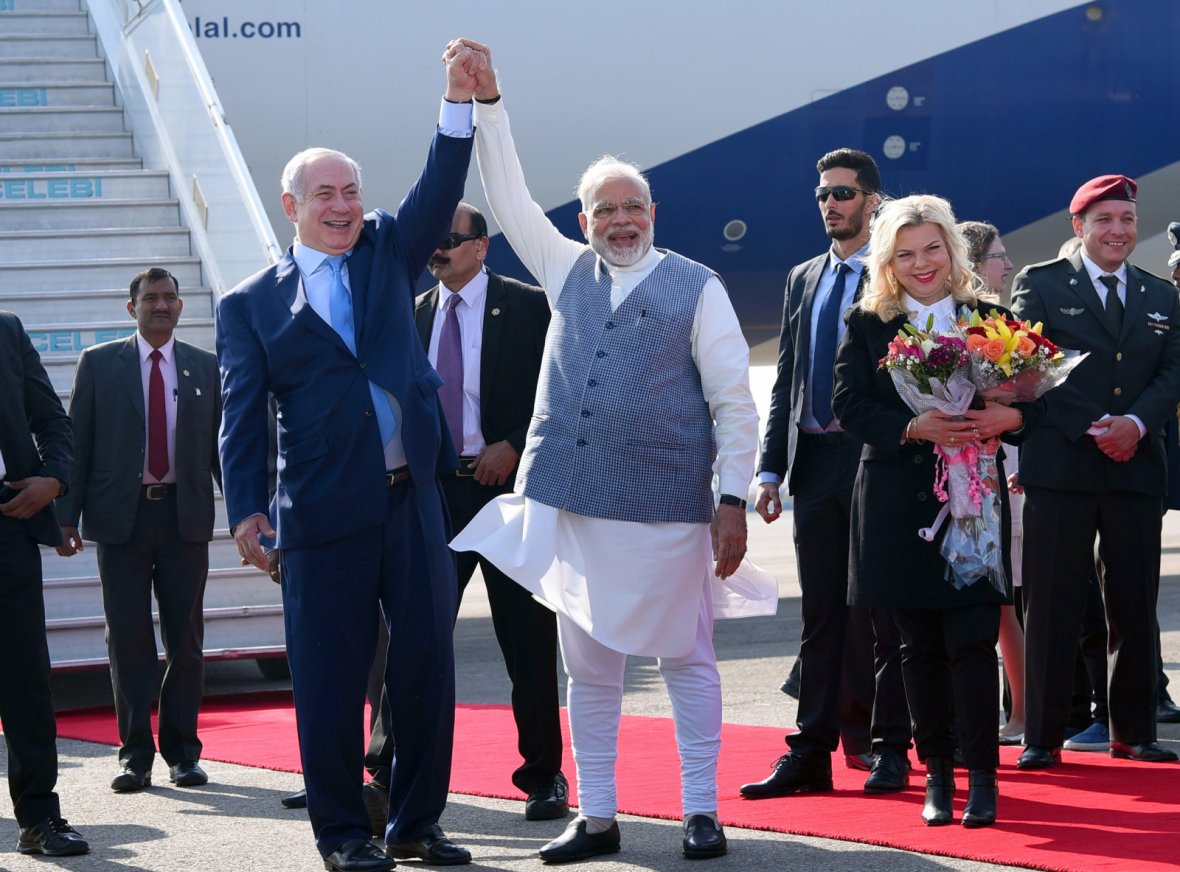 Prime Minister, Shri Narendra Modi welcomes the Prime Minister of Israel, Mr. Benjamin Netanyahu, on his arrival, at Air Force Station, Palam