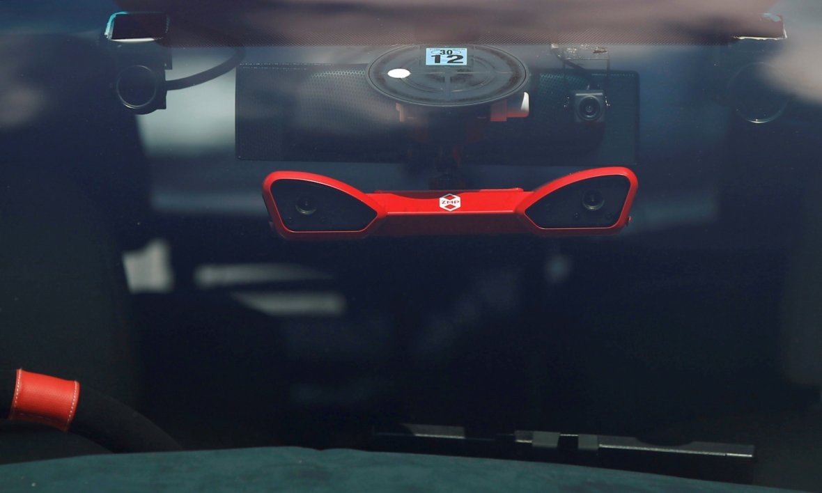 A stereo vision camera is seen on ZMP Inc's RoboCar MiniVan, a self-driving Toyota Estima Hybrid car