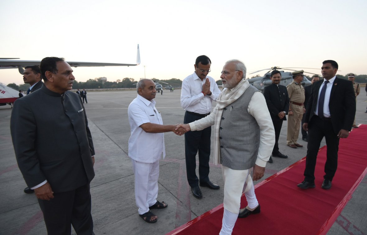  Prime Minister Narendra Modi being seen off by the Chief Minister of Gujarat,  Vijay Rupani and the Chief Minister of Gujarat,  Nitinbhai Patel, on his departure from Ahmedabad 