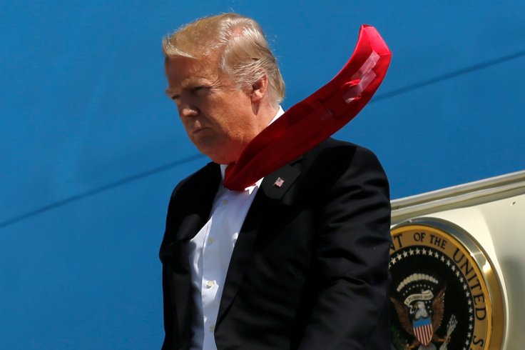 President Donald Trump arrives aboard Air Force One at Orlando International Airport in Orlando, Florida