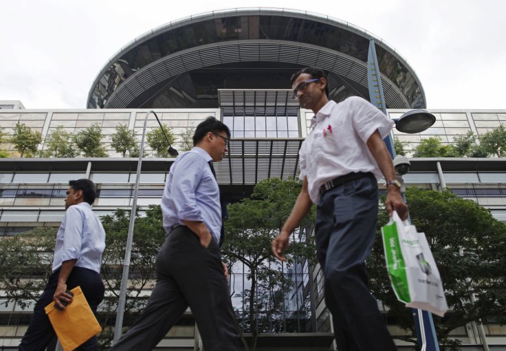 People walk past the Supreme Court in Singapore 