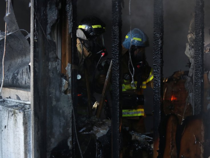 Firefighters put out a fire at a burning hospital in Miryang, South Korea