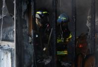Firefighters put out a fire at a burning hospital in Miryang, South Korea