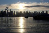 Ice coats the Hudson River as a river ferry departs for New York City from Weehawken, New Jersey, U.S.
