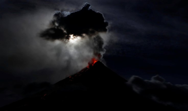 super blue moon illuminates Mayon Volcano as it spews lava during a mild eruption