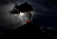 super blue moon illuminates Mayon Volcano as it spews lava during a mild eruption
