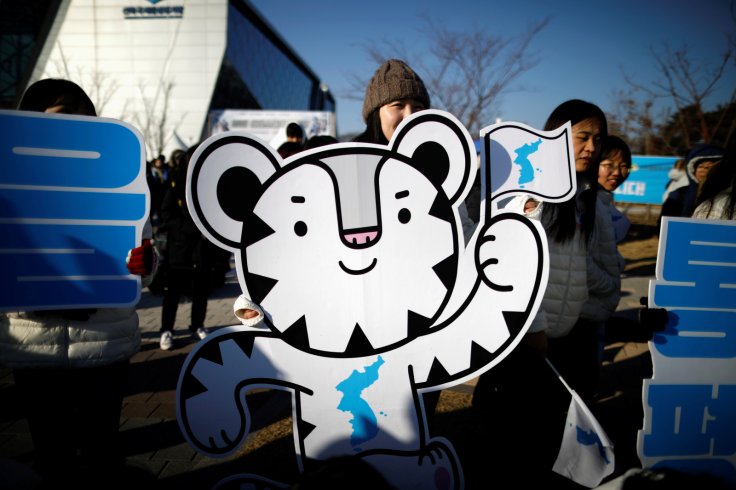 2018 PyeongChang Winter Olympics mascot Soohorang is seen as South Korean supporters cheer for the inter-Korean women's ice hockey athletes before their friendly match against Sweden in Incheon, South Korea, 