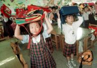 School children practice anti-earthquake skill in Taipei