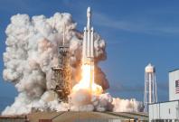 A SpaceX Falcon Heavy rocket lifts off from historic launch pad 39-A at the Kennedy Space Center
