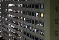 Residents and people crowd the corridors of a public housing estate Residents and people crowd the corridors of a public housing estate