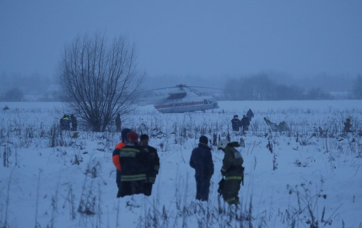 Emergency services work at the scene where a short-haul regional Antonov AN-148 plane crashed after taking off from Moscow's Domodedovo airport, outside Moscow