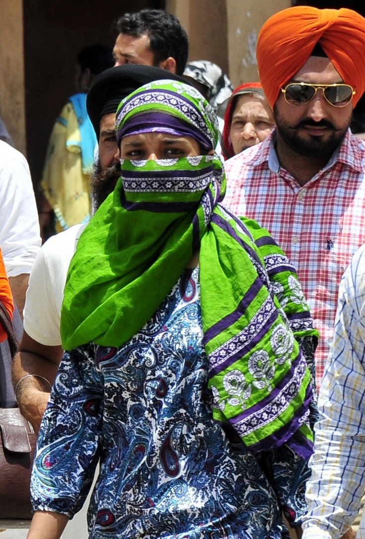 People cover their faces to avoid direct contact with sun on a hot day 