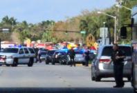 Police cars are seen in Coral Springs after a shooting at the Marjory Stoneman Douglas High School in Parkland, Florida