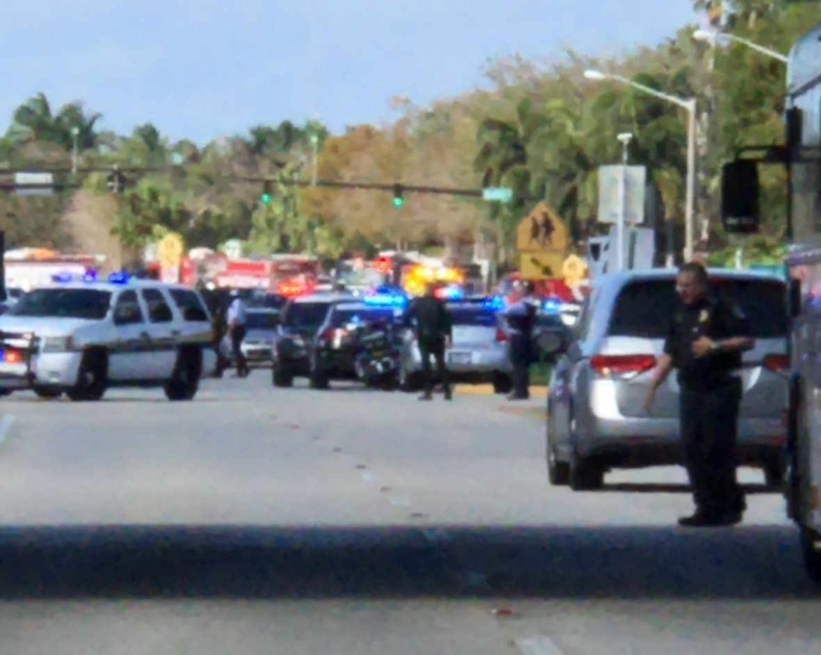 Police cars are seen in Coral Springs after a shooting at the Marjory Stoneman Douglas High School in Parkland, Florida