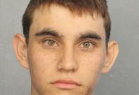 Nikolas Cruz appears in a police booking photo after being charged with 17 counts