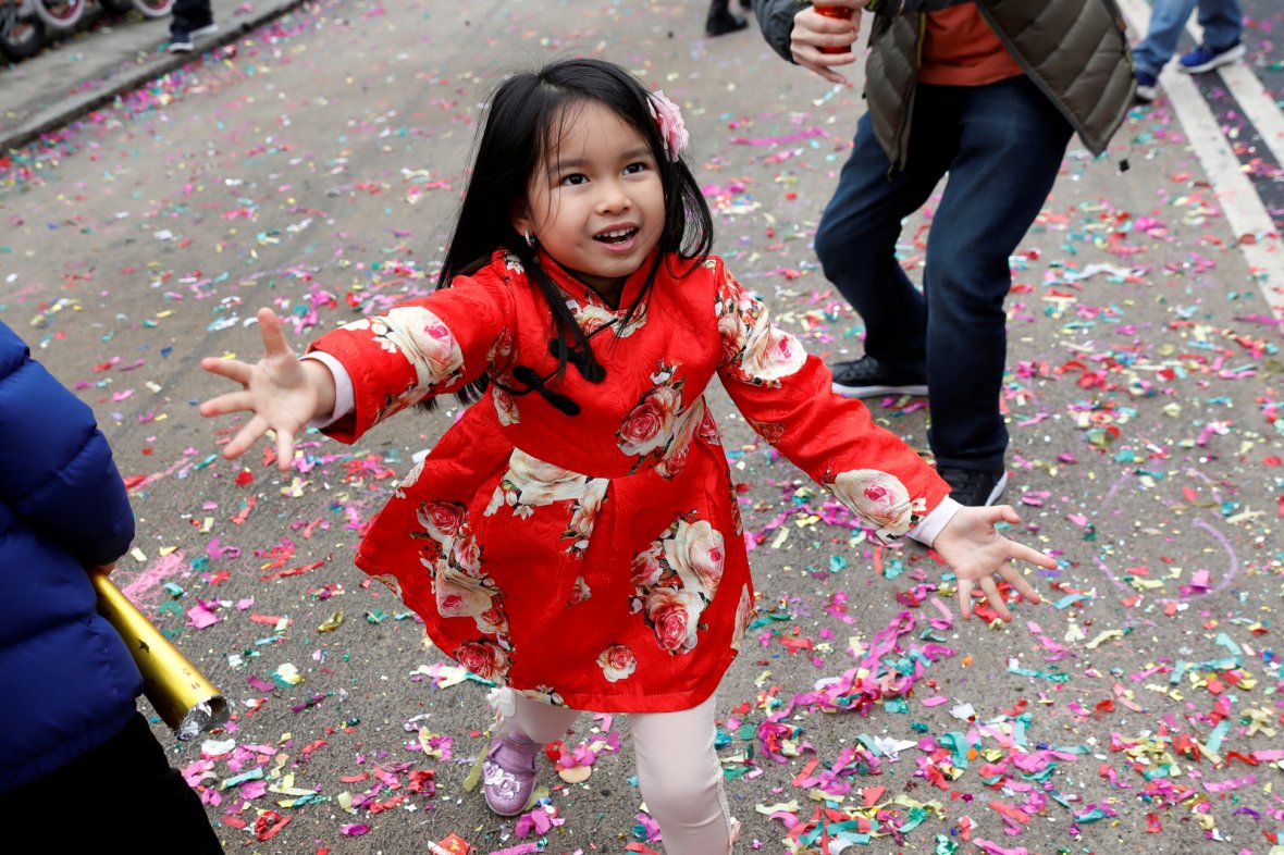 A child celebrates the Chinese Lunar New Year of the Dog in Manhattan's Chinatown in New York
