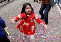 A child celebrates the Chinese Lunar New Year of the Dog in Manhattan's Chinatown in New York
