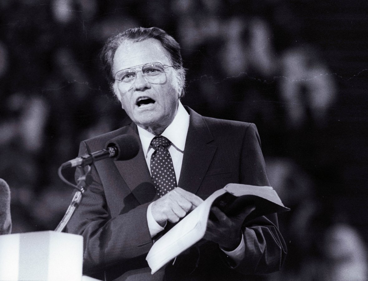 Billy Graham preaches the Gospel to thousands of believers in Paris as part of a worldwide crusade in 1986