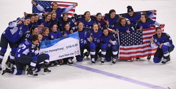 Team USA pose for group photos after winning women's ice hockey final against Canada at Gangneung Hockey Centre