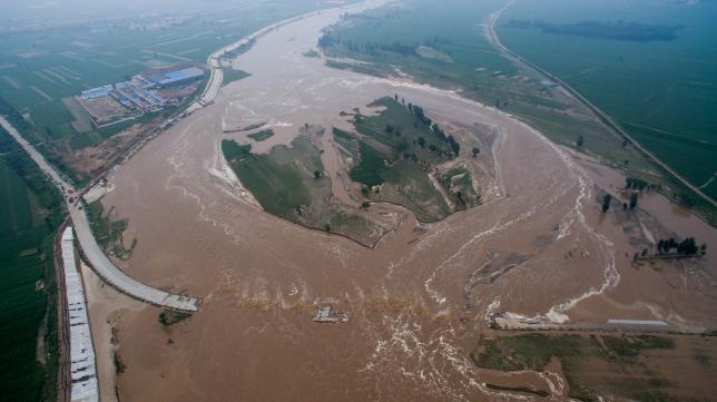 Heavy rainfall and flood in China kills at least 87, thousands evacuated