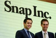 Snap cofounders Evan Spiegel (R) and Bobby Murphy wait to ring the opening bell of the New York Stock Exchange (NYSE) shortly before the company's IPO in New York