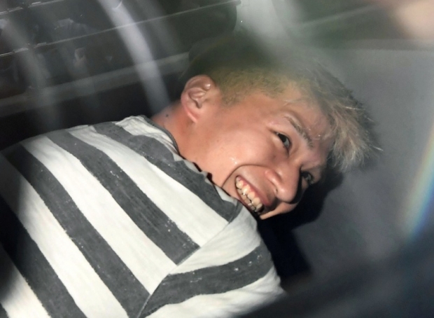 Japan knife attack: Suspect grins for the cameras, says he wanted disable people to disappear
