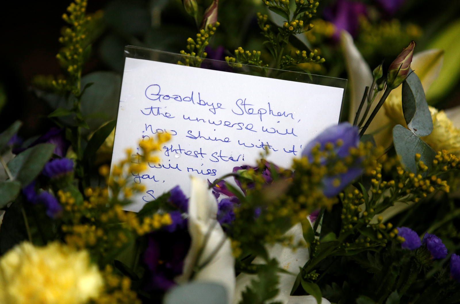 A floral tribute left outside Great St Marys Church, where the funeral of theoretical physicist Prof Stephen Hawking is being held, in Cambridge, Britain, March 31, 2018. 