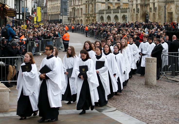 Members of the church choir arrive at Great St Marys Church, where the funeral of theoretical physicist Prof Stephen Hawking is being held, in Cambridge, Britain, March 31, 2018.