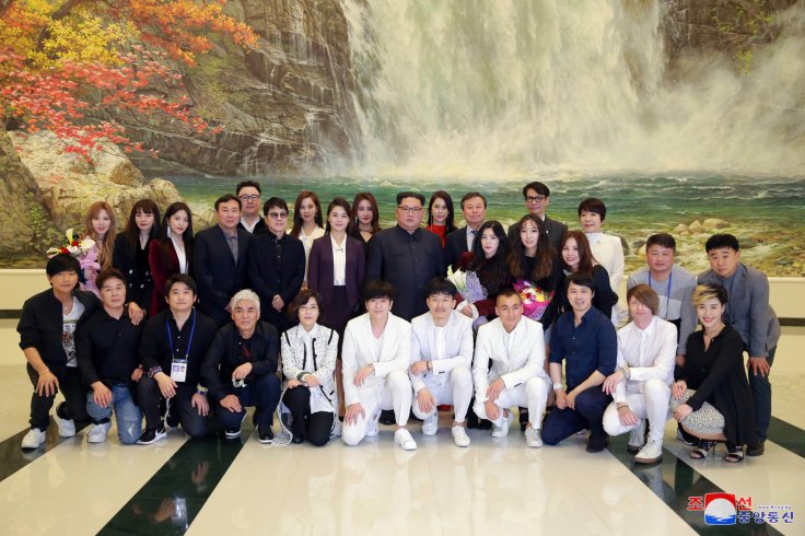 North Korean leader Kim Jong Un poses with South Korean K-pop singers in this photo released by North Korea's Korean Central News Agency (KCNA) in Pyongyang April 2, 2018.