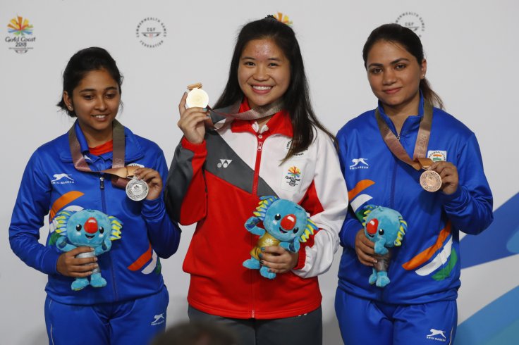 Shooting - Gold Coast 2018 Commonwealth Games - Women's 10m Air Rifle - Final - Belmont Shooting Centre - Brisbane, Australia - April 9, 2018. Gold medallist Martina Lindsay Veloso of Singapore, silver medallist Mehuli Ghosh of India and bronze medallist 