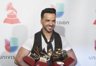 Luis Fonsi holds his awards for Song of the Year, Record of the Year and Best Long Form Music Video for "Despacito" and Best Urban Fusion/Performance for "Despacito (Remix)". Luis Fonsi holds his awards for Song of the Year, Record of the Year and Best Long Form Music Video for "Despacito" and Best Urban Fusion/Performance for "Despacito (Remix)".