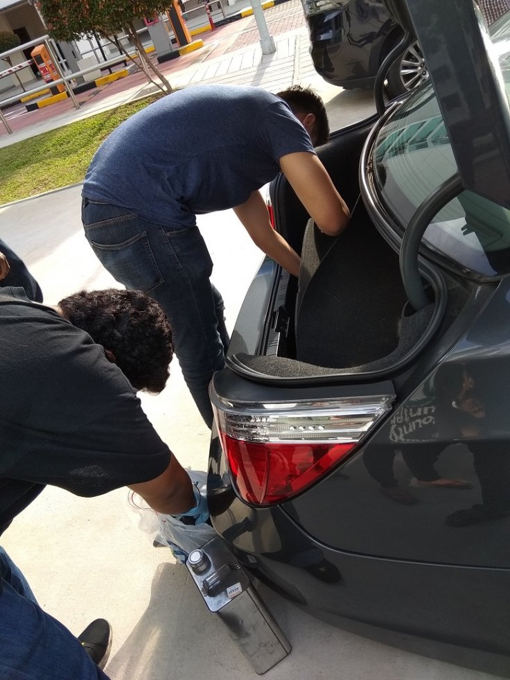 CNB officers conducting a search of a suspect’s car, during CNB’s 11-day island-wide operation from 16 to 27 April 2018.