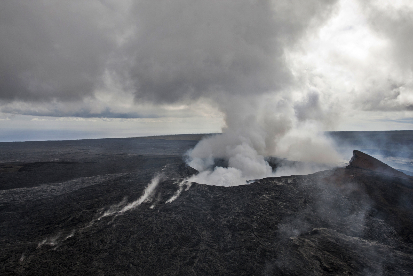 Smoke rises from the Pu'u O'o vent on the Kilauea Volcano October 29, 2014 on the Big Island of Hawaii. 