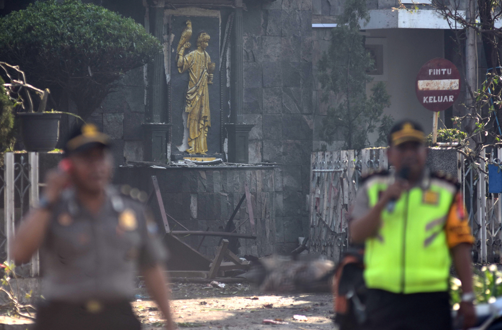 Police are seen outside the Immaculate Santa Maria Catholic Church following a blast, in Surabaya, East Java, Indonesia May 13, 2018 in this photo taken by Antara Foto. Antara Foto/M Risyal Hidayat / via REUTERS ATTENTION EDITORS - THIS IMAGE WAS PROVIDED