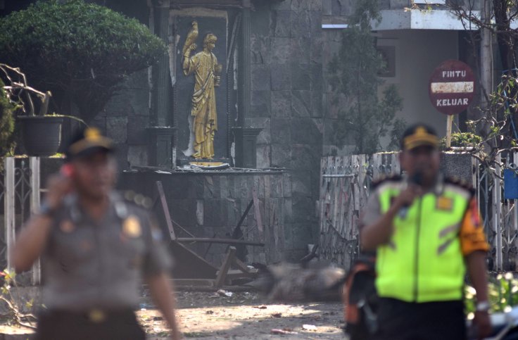 Police are seen outside the Immaculate Santa Maria Catholic Church following a blast, in Surabaya, East Java, Indonesia May 13, 2018 in this photo taken by Antara Foto. Antara Foto/M Risyal Hidayat / via REUTERS ATTENTION EDITORS - THIS IMAGE WAS PROVIDED
