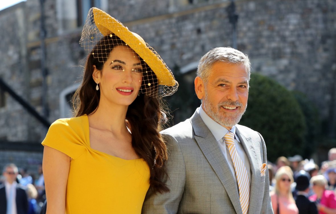 Amal Clooney and George Clooney arrive at St George's Chapel at Windsor Castle for the wedding of Meghan Markle and Prince Harry. 