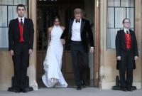 The newly married Duke and Duchess of Sussex, Meghan Markle and Prince Harry, leaving Windsor Castle after their wedding to attend an evening reception at Frogmore House, hosted by the Prince of Wales Windsor, 