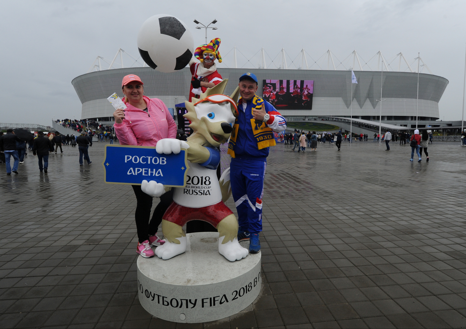  Russian Football Championship - FC Rostov vs FC Ural - Rostov Arena, Rostov-on-Don, Russia - May 13, 2018 Fans pose with the official mascot for the 2018 FIFA World Cup Zabivaka outside the stadium before the match. 