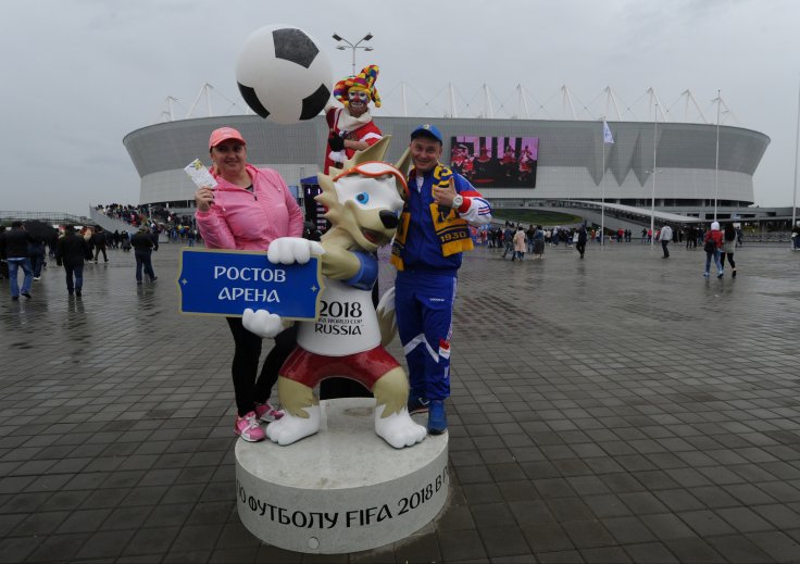  Russian Football Championship - FC Rostov vs FC Ural - Rostov Arena, Rostov-on-Don, Russia - May 13, 2018 Fans pose with the official mascot for the 2018 FIFA World Cup Zabivaka outside the stadium before the match. 