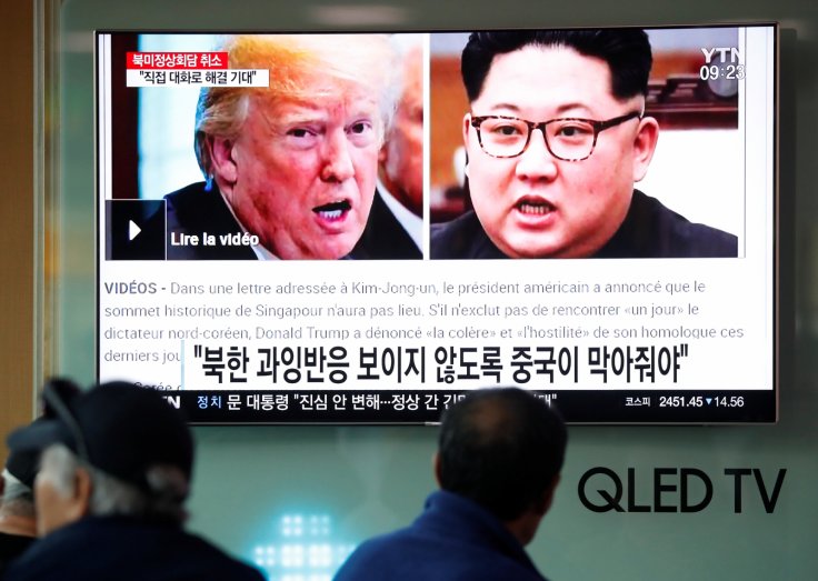 People watch a TV broadcasting a news report on a cancelled summit between the U.S. and North Korea, in Seoul, South Korea, May 25, 2018.