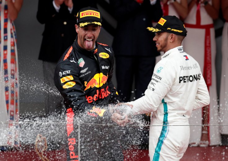 Formula One F1 - Monaco Grand Prix - Circuit de Monaco, Monte Carlo, Monaco - May 27, 2018 Red Bull’s Daniel Ricciardo celebrates winning the race with Mercedes' Lewis Hamilton who finished third 