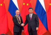 russian-president-vladimir-putin-receives-friendship-medal-from-chinese-president-xi-jinping russian-president-vladimir-putin-receives-friendship-medal-from-chinese-president-xi-jinping