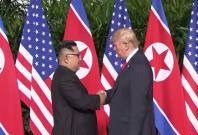trump-and-kim-jong-un-shake-hands-in-historic-summit-meeting trump-and-kim-jong-un-shake-hands-in-historic-summit-meeting