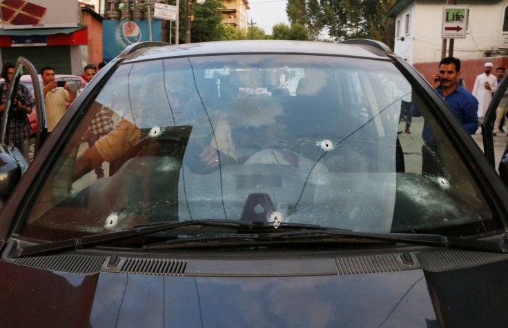 Bullet marks are seen on the car of Syed Shujaat Bukhari, the editor of Rising Kashmir daily newspaper, after unidentified gunmen attacked him outside his office in Srinagar, June 14, 2018.