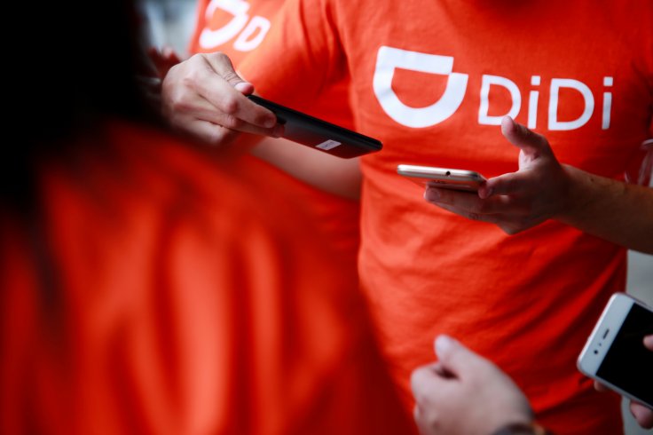 The logo of Chinese ride-hailing firm Didi Chuxing is seen on a t-shirt of an employee outside their new drivers center in Toluca, Mexico, 