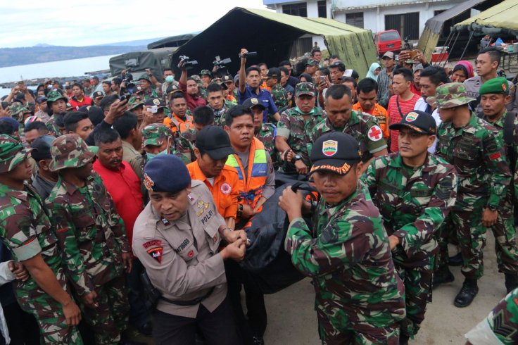 Indonesian security forces and rescue workers carry a victim recovered after a ferry sank in Lake Toba, at Tigaras Port in Simalungun, North Sumatra, Indonesia June 20, 2018 in this photo taken by Antara Foto.