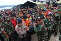 Indonesian security forces and rescue workers carry a victim recovered after a ferry sank in Lake Toba, at Tigaras Port in Simalungun, North Sumatra, Indonesia June 20, 2018 in this photo taken by Antara Foto. Indonesian security forces and rescue workers carry a victim recovered after a ferry sank in Lake Toba, at Tigaras Port in Simalungun, North Sumatra, Indonesia June 20, 2018 in this photo taken by Antara Foto.