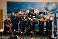 Malaysian police seized cash and illegal items