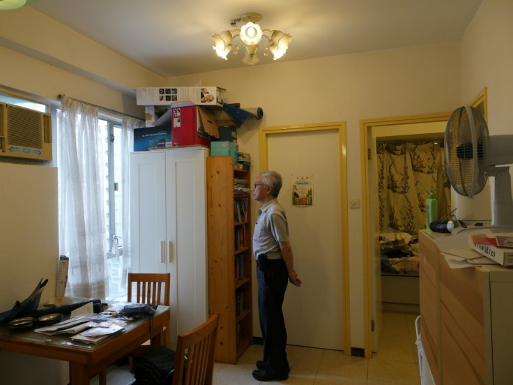 Landlord Ng Goon-lau, 66, poses inside his property where two suicides have taken place, in Hong Kong, China June 8, 2018. Picture taken June 8, 2018. 