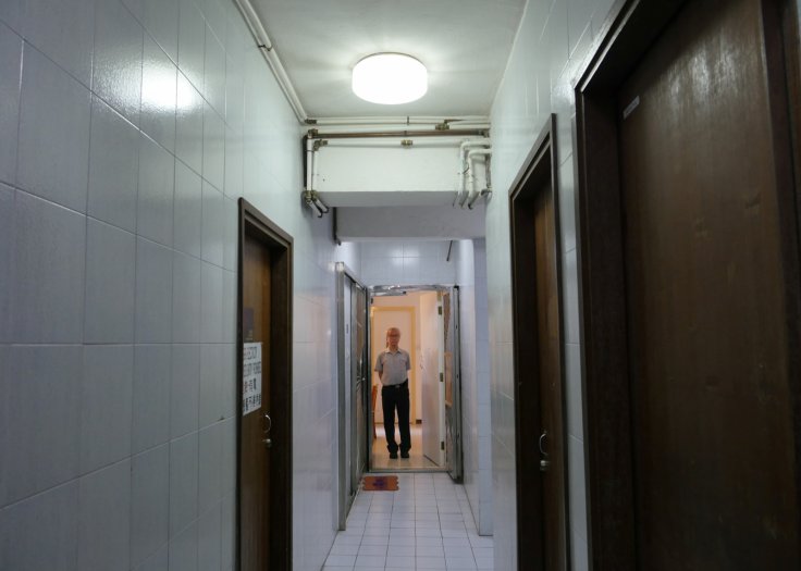 Landlord Ng Goon-lau, 66, poses inside his property where two suicides have taken place, in Hong Kong, China June 8, 2018. Picture taken June 8, 2018. 